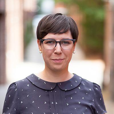 Mary Herman looks directly at the camera smiling