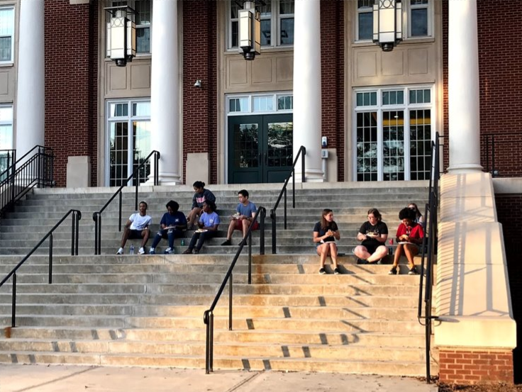 FRC members enjoy a cookout on steps of Rutherford Hall