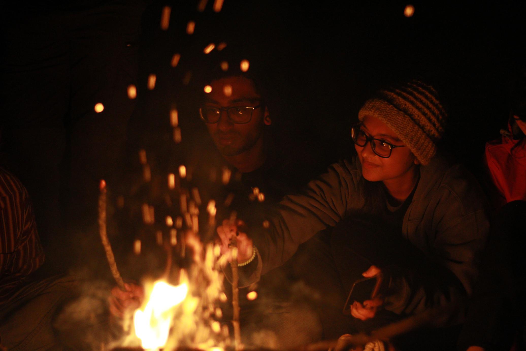 Sudan and Siddhi enjoying the Sapelo bonfire
