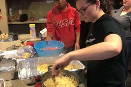 FRC members help cook meals for the local Athens Area Homeless Shelter.